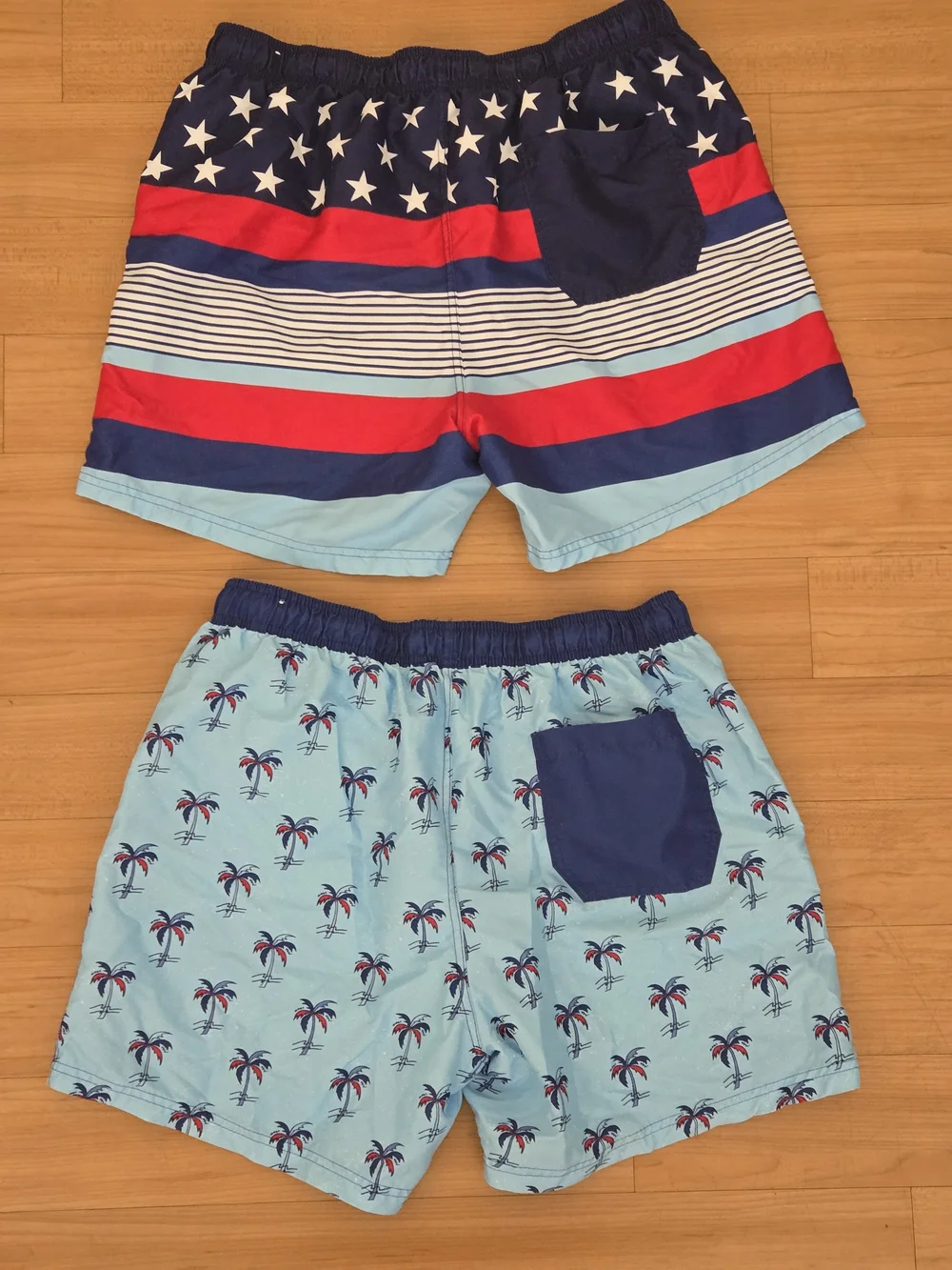 2 Pairs Boys Large Light Blue Palm Print Swim Shorts with Navy & Red Accents